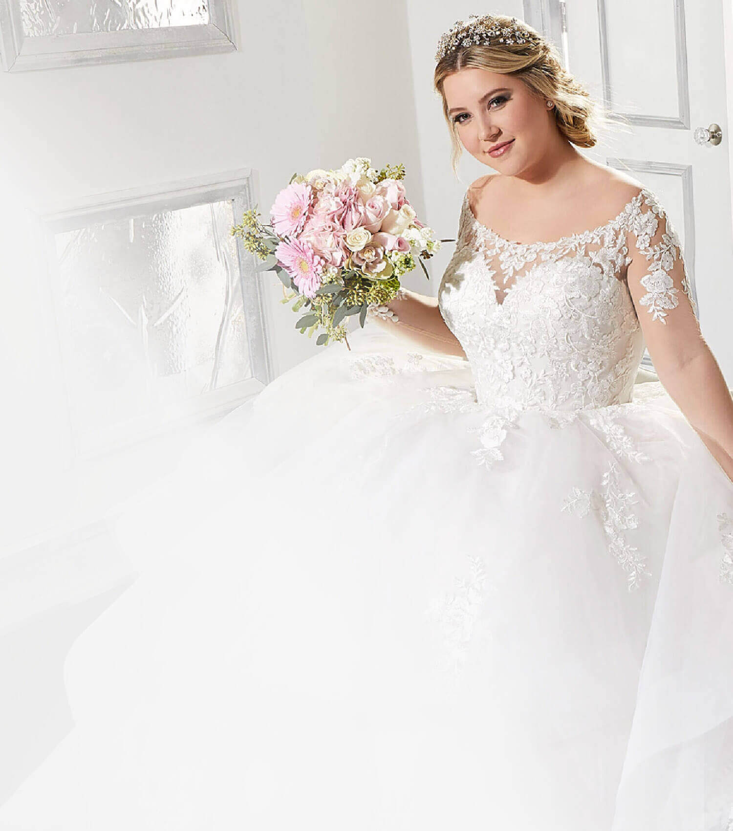 Plus size model wearing a wedding gown