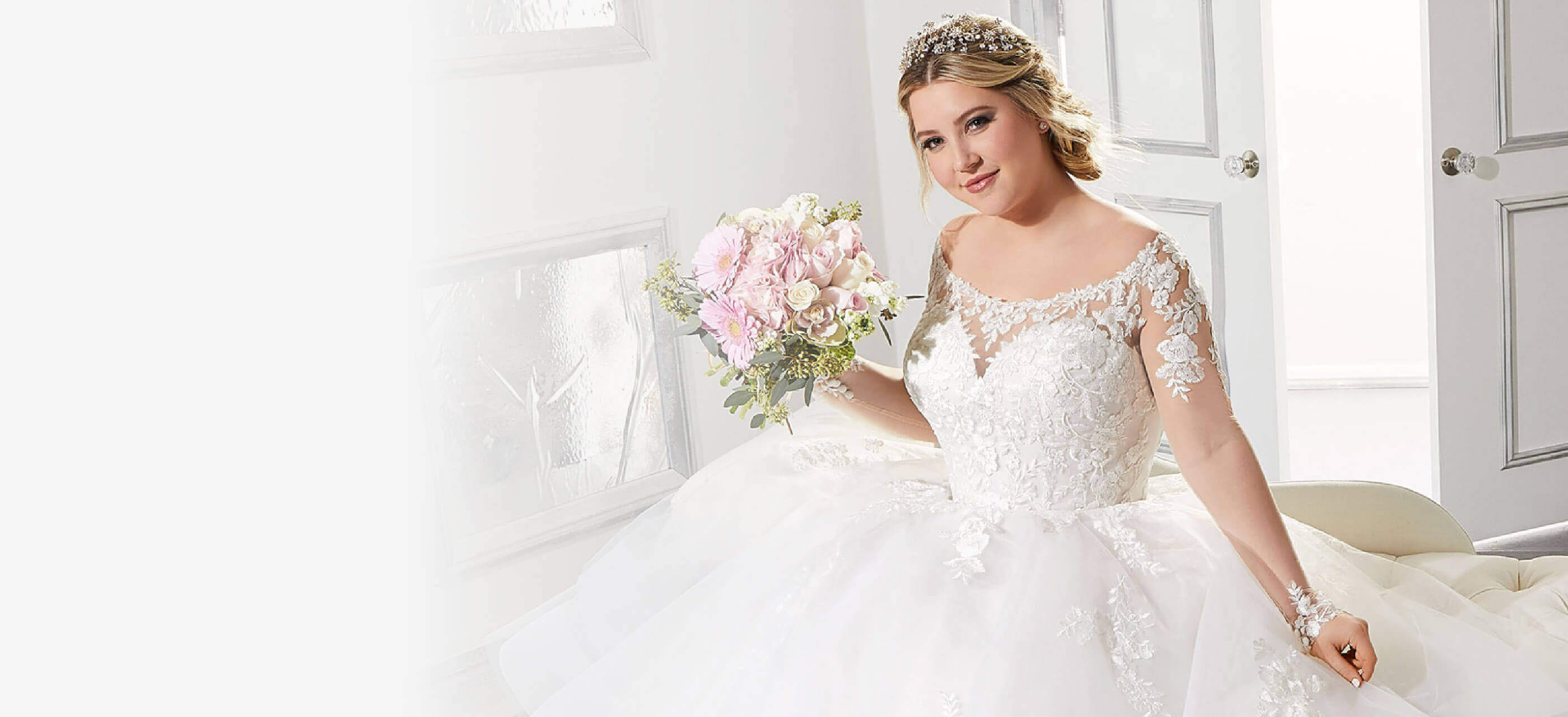 Plus size model wearing a wedding gown