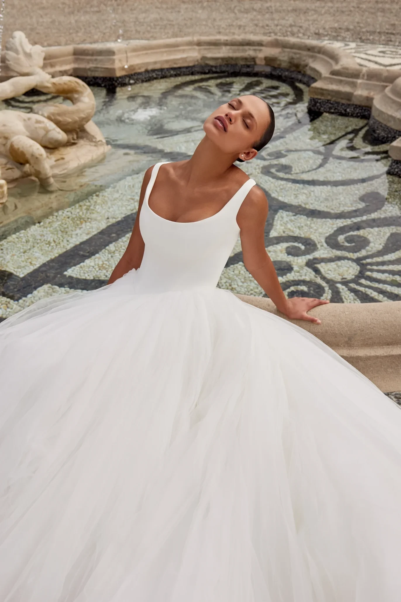 Model wearing a dress by Justin Alexander