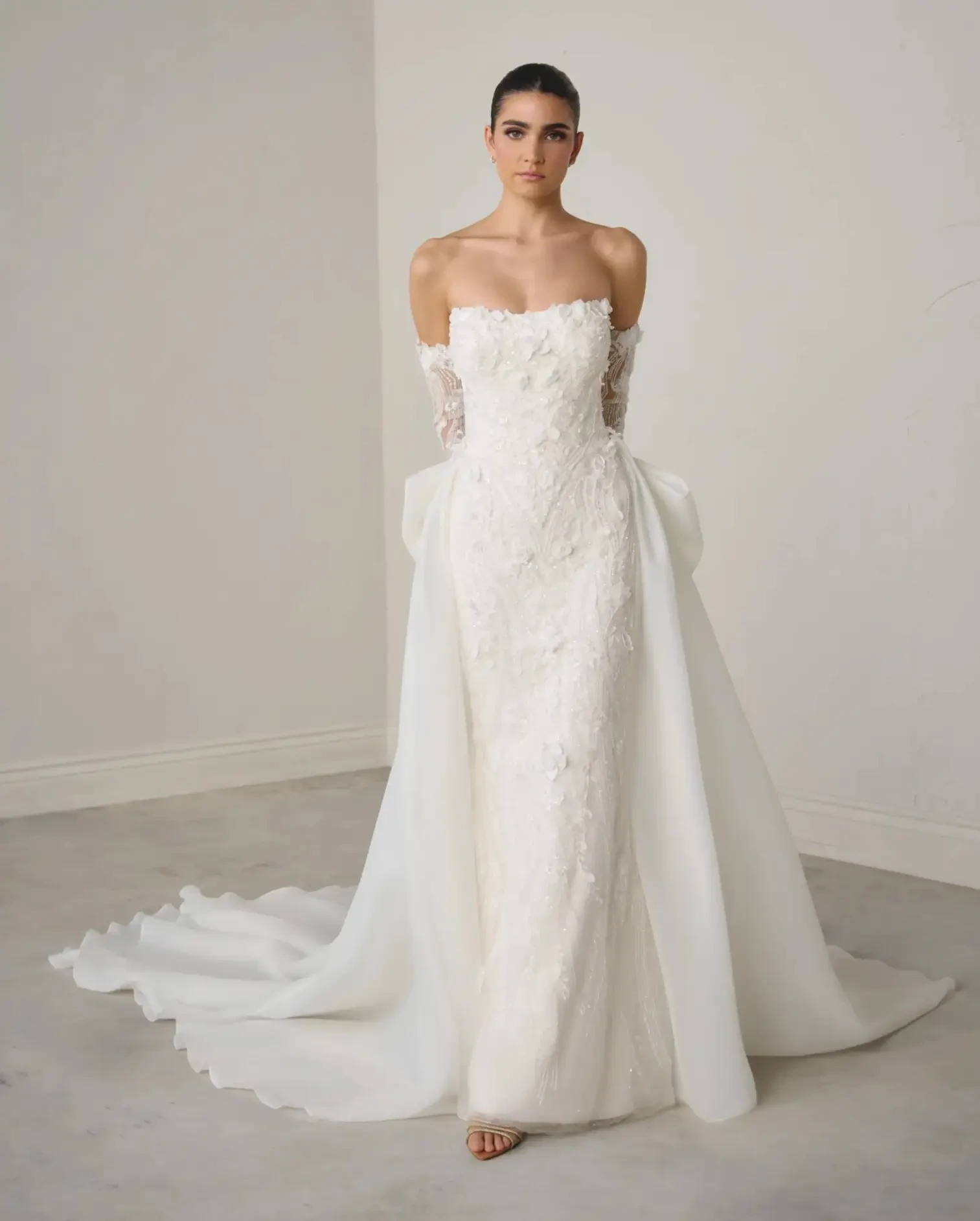 Model wearing a dress by Justin Alexander Signature