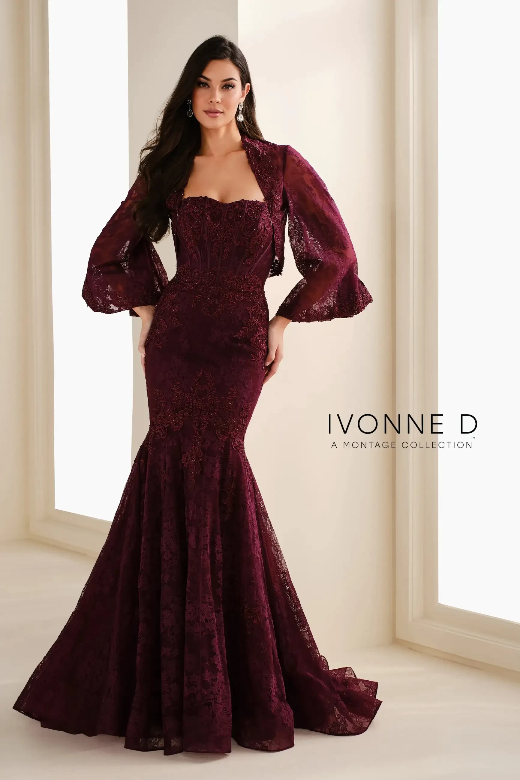 A woman in a burgundy gown with ruffled sleeves poses elegantly against a light background. The gown features intricate lace detailing and completes the look with sophisticated earrings. The text 