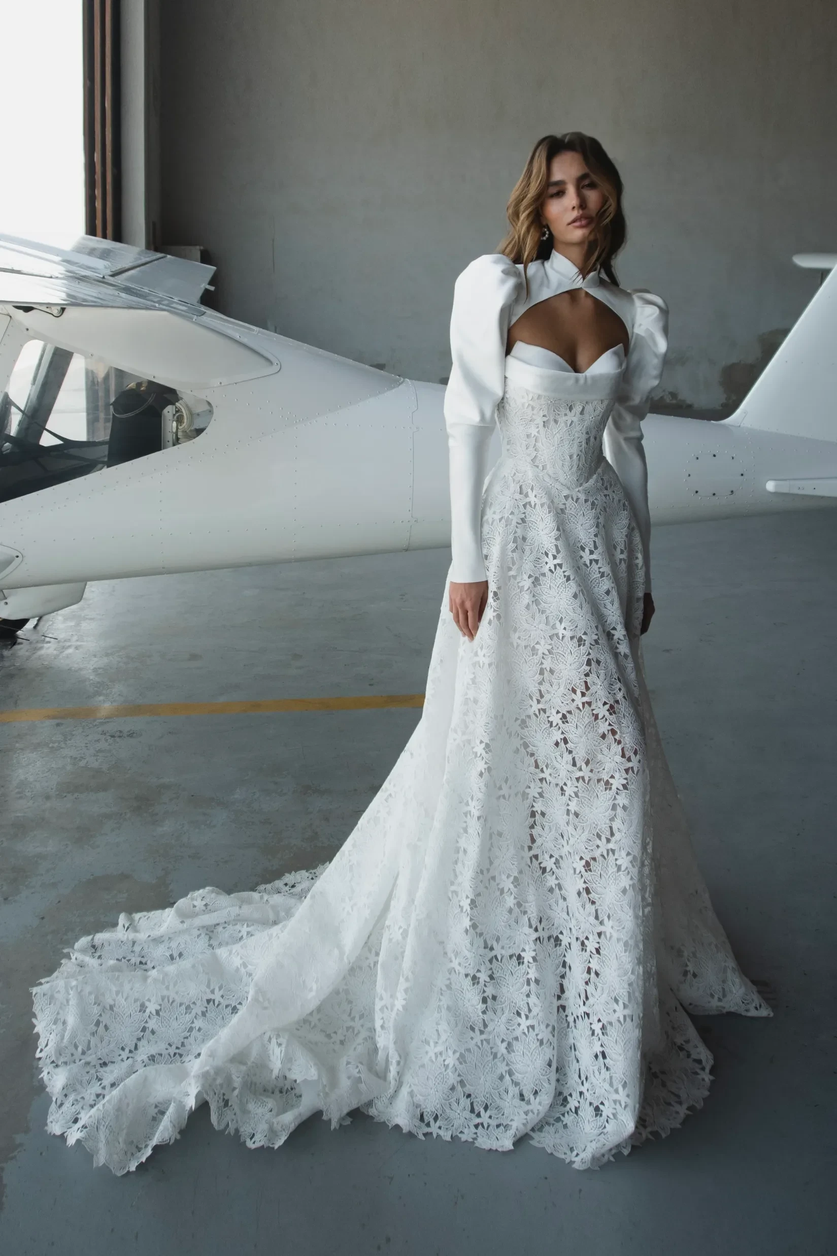 A-line wedding dress with dropped straps and ties. Complete with a removable bolero.